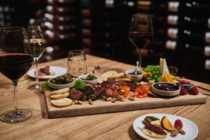 A delicious charcuterie spread with 3 glasses of wine at Sooke Harbour House in Sooke, BC