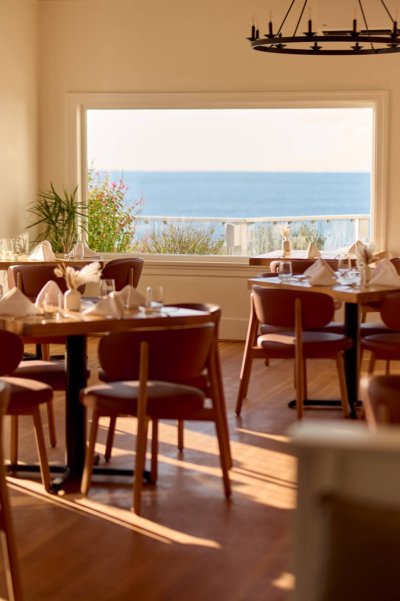 A view of the Dining Room at Sooke Harbour House in Sooke, BC with views of the ocean